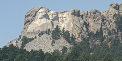 Image of Mount Rushmore from entrance drive from Keystone